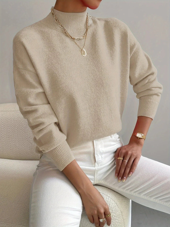 Elegante dames coltrui met hoge hals en soepele pasvorm. Tijdloze stijl voor herfst- en wintermode.