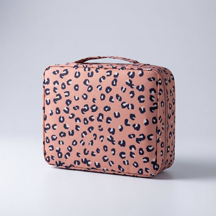 Stijlvolle makeuptas voor dames, compact formaat met handvat, ideaal voor onderweg en thuis.