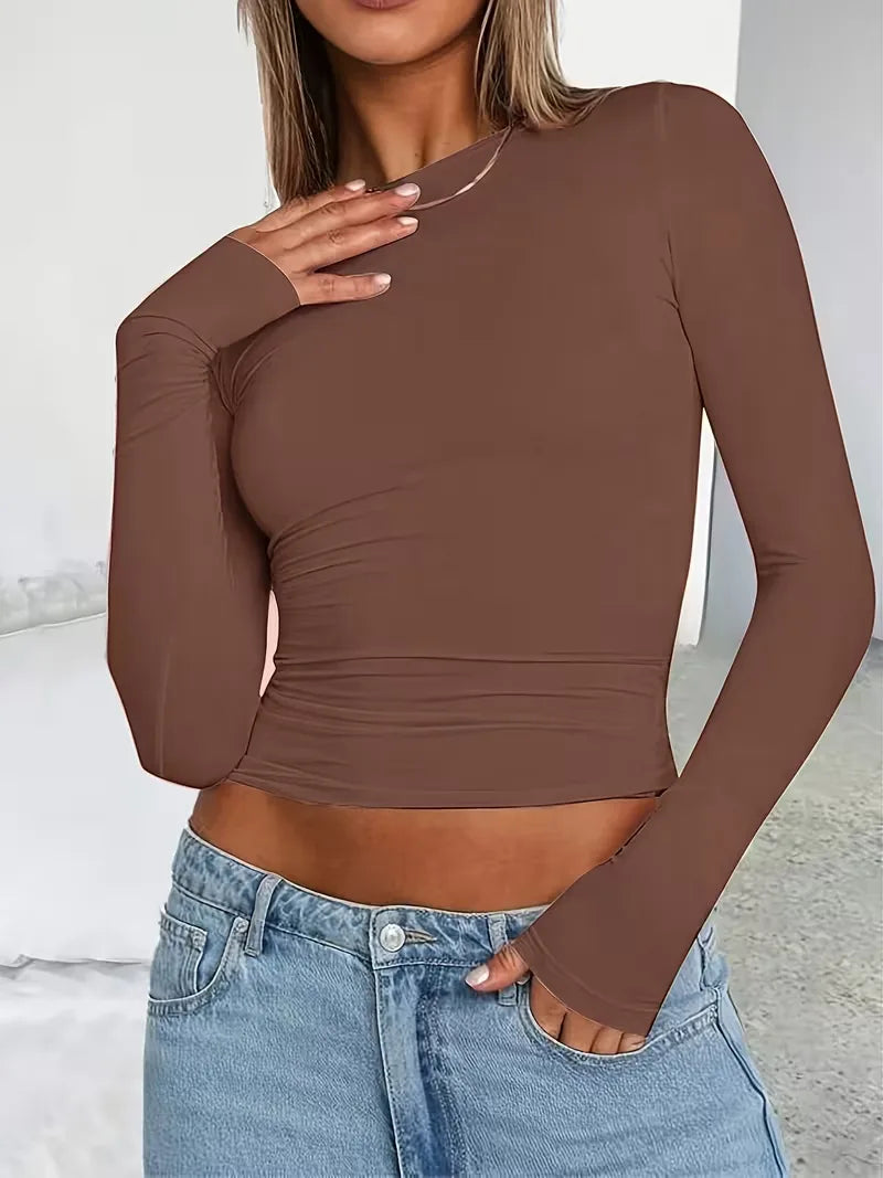 Modieuze dames top met lange mouwen, cropped en slim fit pasvorm, comfortabele ronde hals.