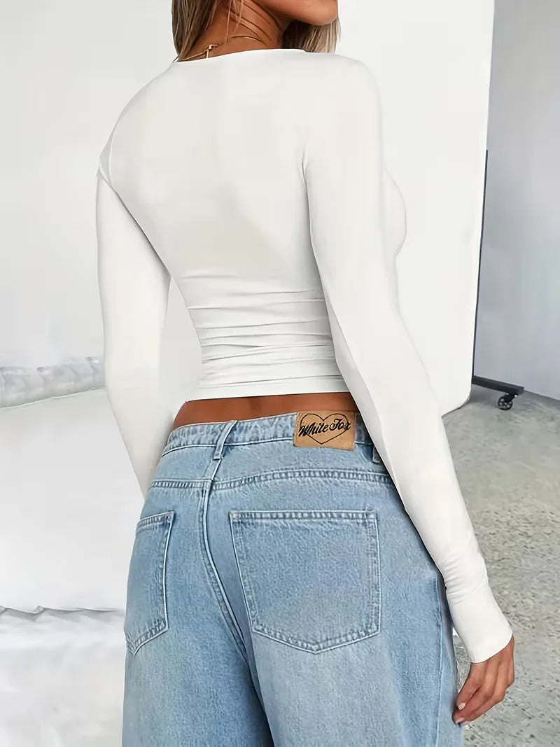 Trendy dames cropped top met lange mouwen en ronde hals, elastische slim fit voor modebewuste vrouw.
