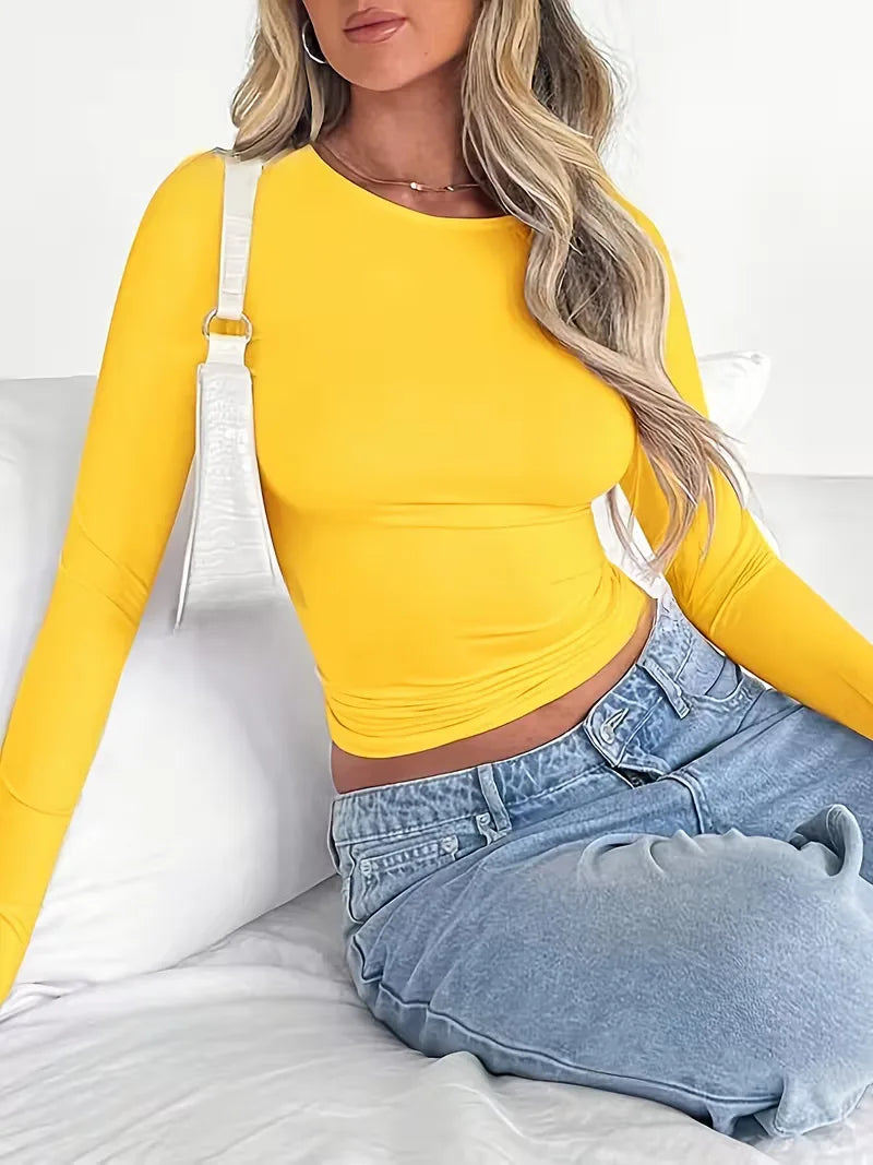 Cropped dames longsleeve met ronde hals en slim fit pasvorm, een must-have voor dagelijks gebruik.