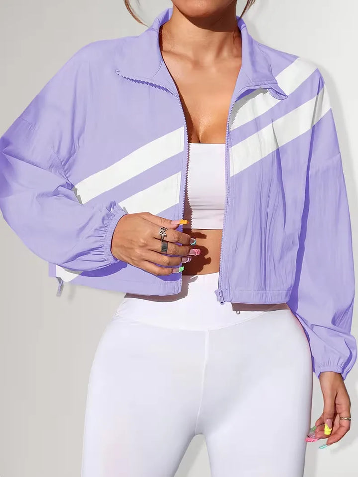 Trendy dames track jacket, cropped model, met rits en verstelbare tailleband.