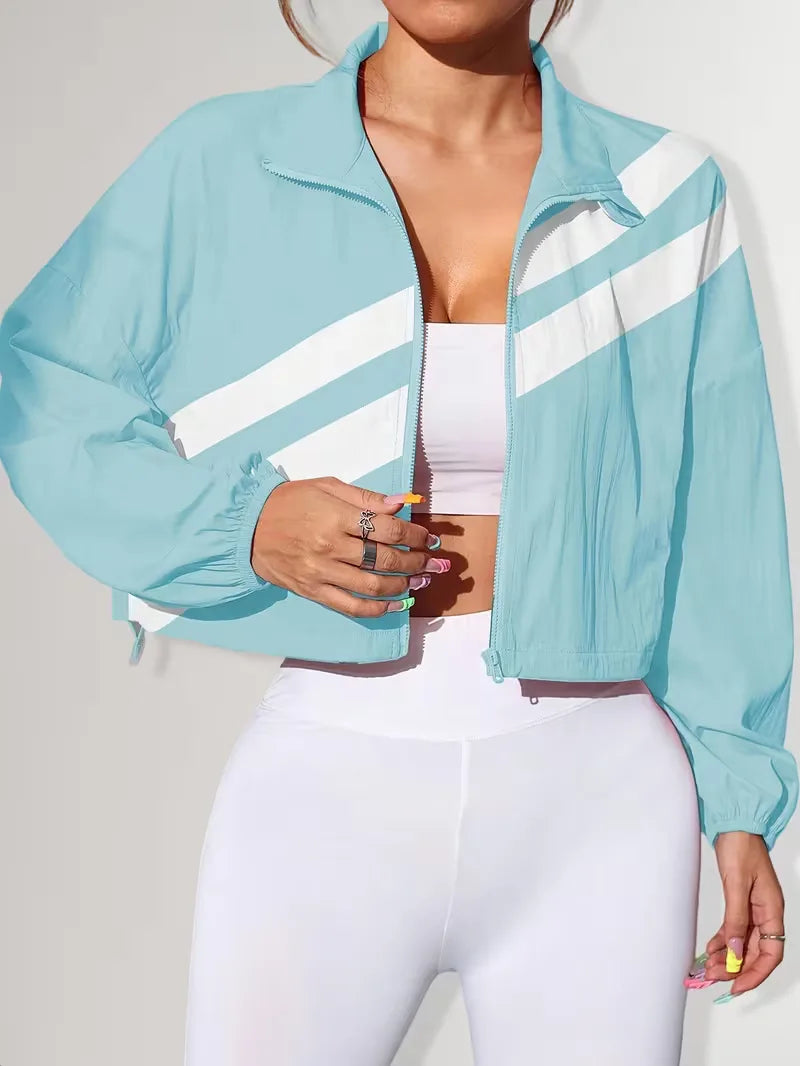 Veelzijdig dames track jacket, ideaal voor lente/herfst, met verstelbare taille en rits.