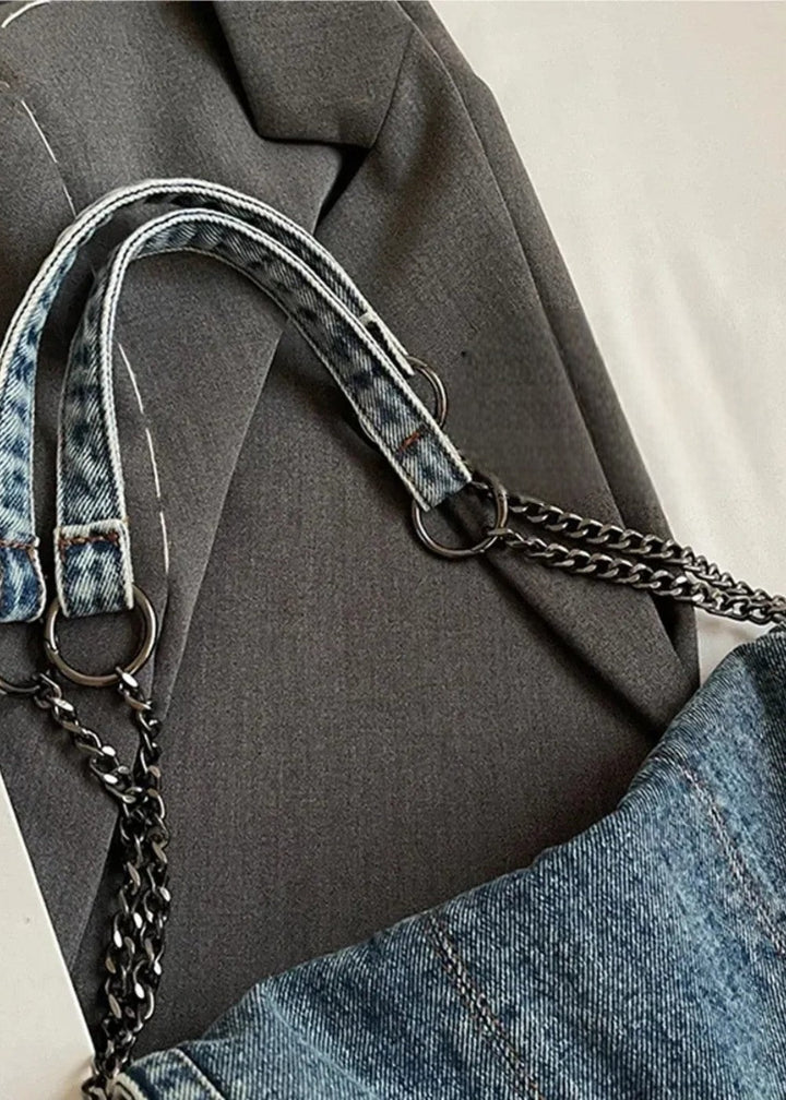 Denim kettingtas voor dames, opvallend metallic hengsel. Perfecte urban accessoire.