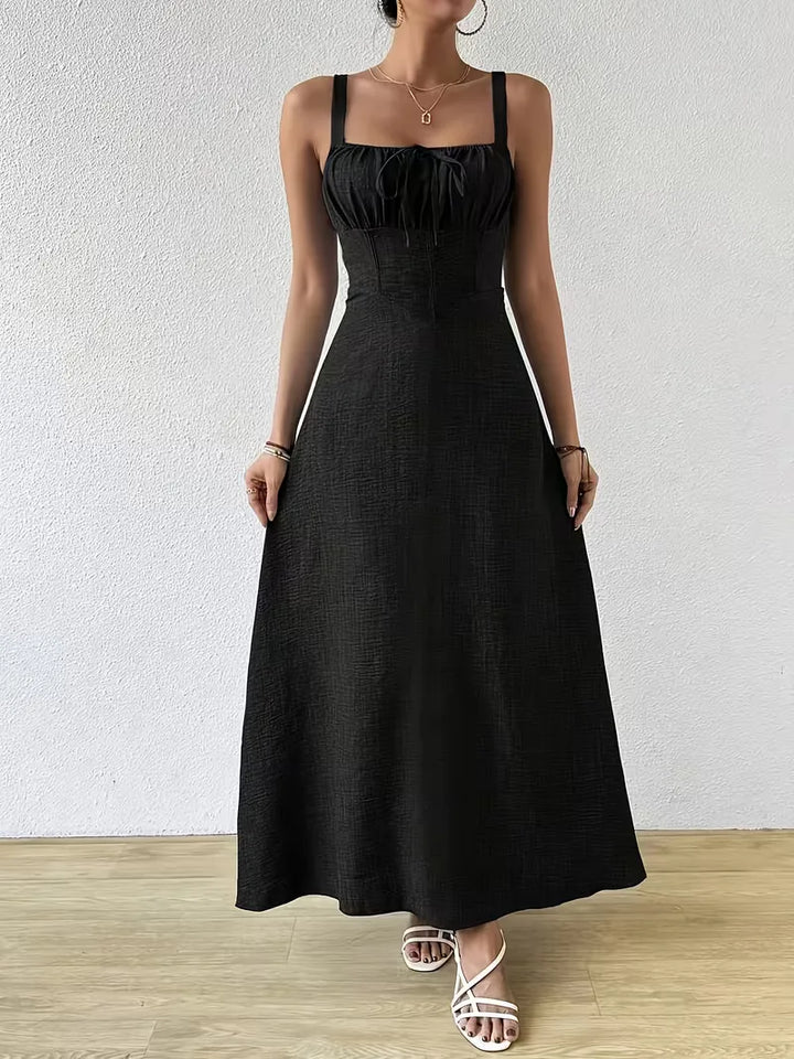 Zomerjurk dames, wikkelmodel met spaghettibandjes, ideaal voor vakantie.