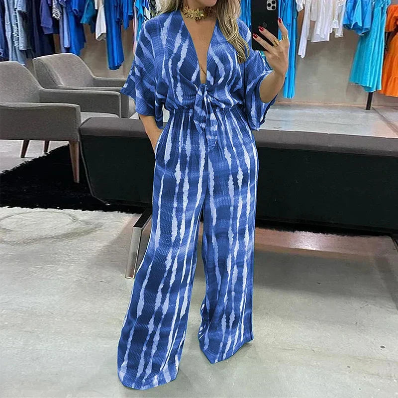 Trendy dames jumpsuit Elyndra met comfortabele wijde pijpen en flatterende V-hals, perfect voor lente/zomer mode.
