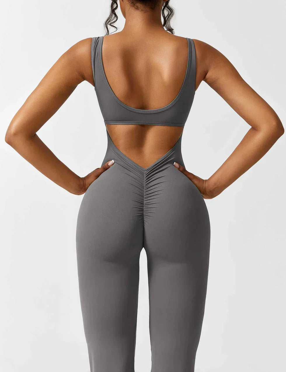 Dames figuurvormende jumpsuit, flared en elastisch, met V-rug voor een stijlvolle look.