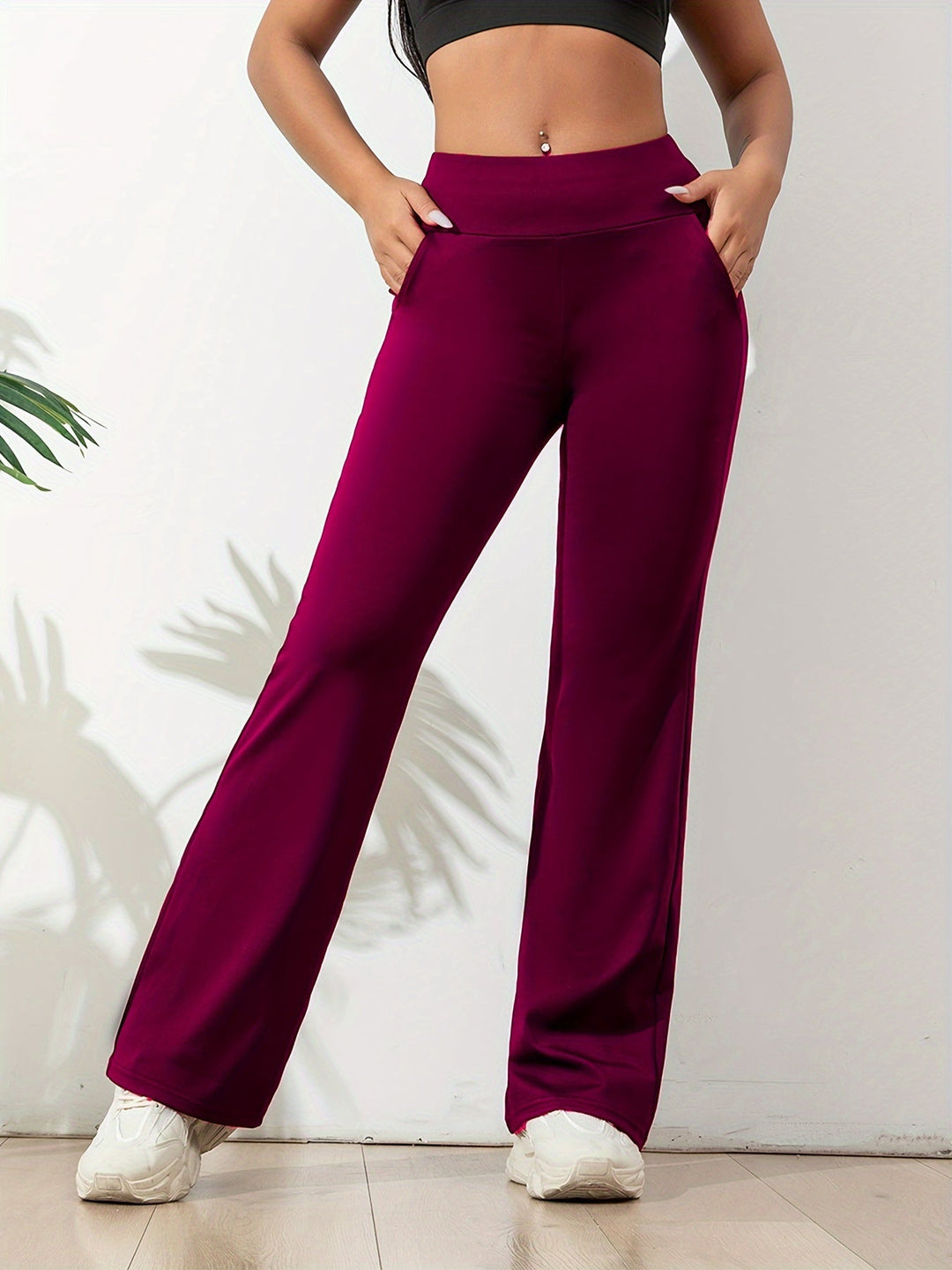 Comfortabele dames flared legging met hoge taille en zakken, perfect voor thuis of vrije tijd.