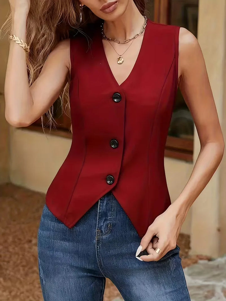 Zomers damesgilet met V-hals en knoopsluiting, in slimfit model. Een trendy, mouwloze toevoeging aan je garderobe.