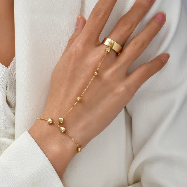 Uniek design goudkleurige handketting voor dames, elegantie om de hand en pols.