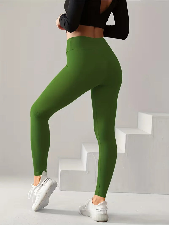 Effen zwarte high-waisted slim fit dames legging. Stretchstof voor yoga, sport of als casual lente kleding.