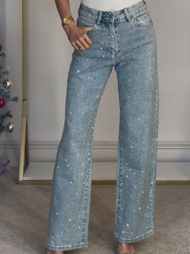Dames hoge taille sparkle jeans, elegant gesneden met subtiele glinsters voor een stijlvolle look.