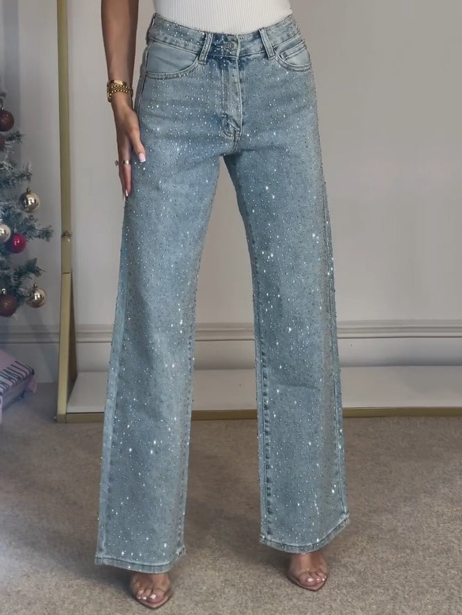 Blauwe dames jeans met hoge taille en sprankelende details, ideaal voor casual chic comfort.