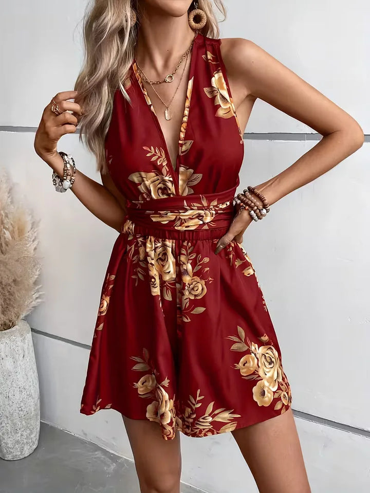 Dames jumpsuit met bloemenprint, perfect voor zomerse boho-stijl en vakantie. Mouwloos met wijde pijpen.