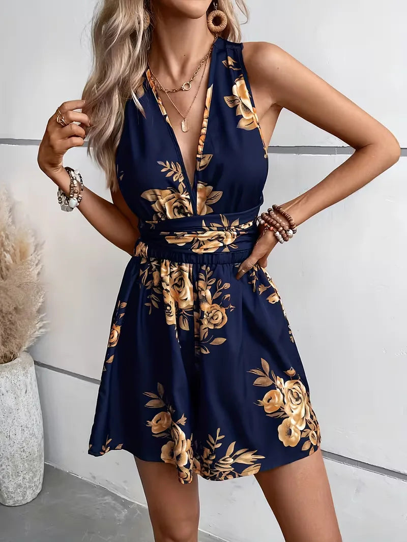 Stijlvolle dames jumpsuit met bloemenprint, mouwloos, knoopdetail, ideaal voor zomerse casual outfits.