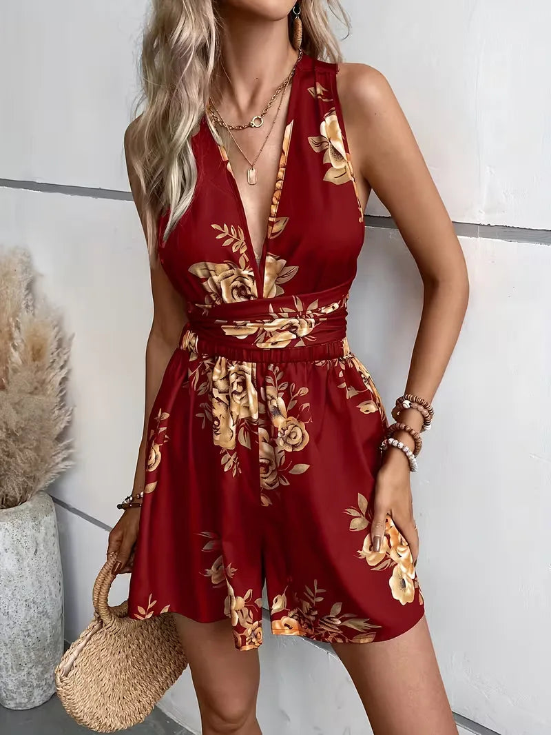 Casual zomer jumpsuit voor dames met bohemian bloemenprint, knoopdetail, ideaal voor vakantie.