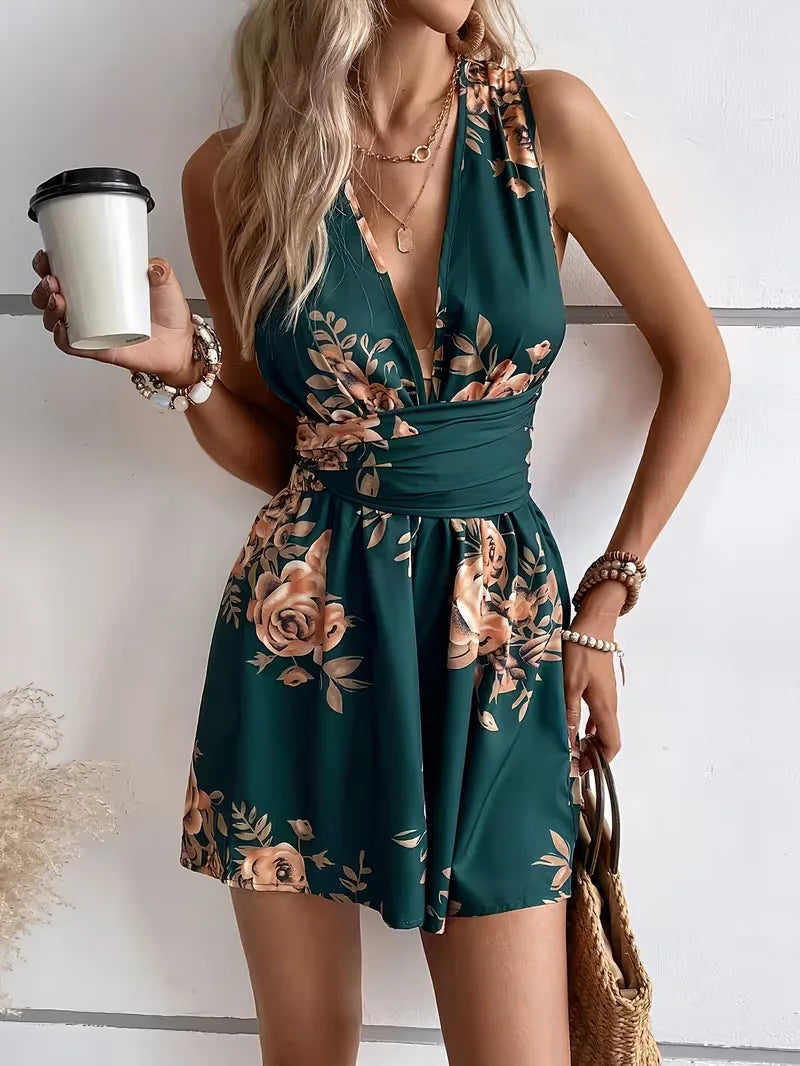 Boho-stijl dames jumpsuit met V-hals, bloemenprint en knoopdetail, ideaal voor de zomer en vakantie.