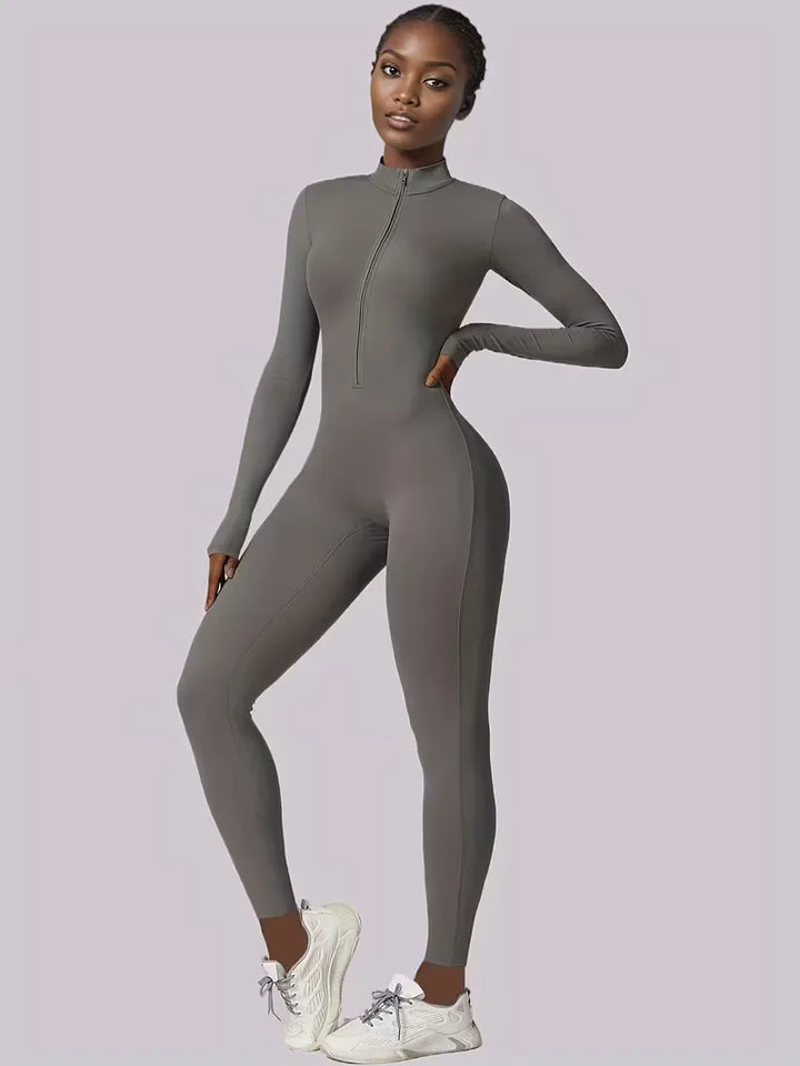 Fitnesskleding: rekbare dames jumpsuit met lange mouwen, comfortabel en sportief voor workouts.
