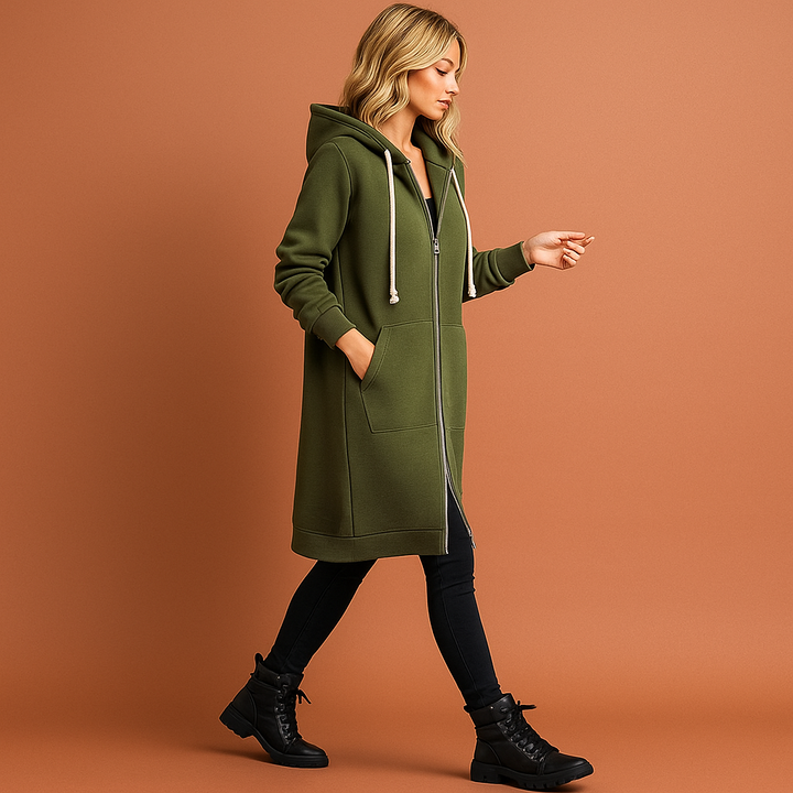 Modieuze dames knielange hoodie met praktische ritssluiting. Comfortabel en warm ritsvest, ideaal voor koude dagen.