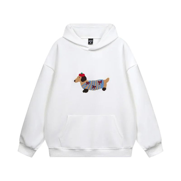 Zachte dames hoodie met uniek geborduurd teckel design. Cozy trui voor ontspannen winteravonden.