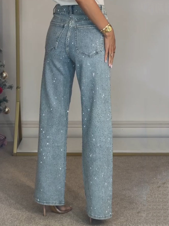 Trendy damesbroek: lichtblauw, flared met wijde pijpen, glanzend materiaal en comfortabele hoge taille.