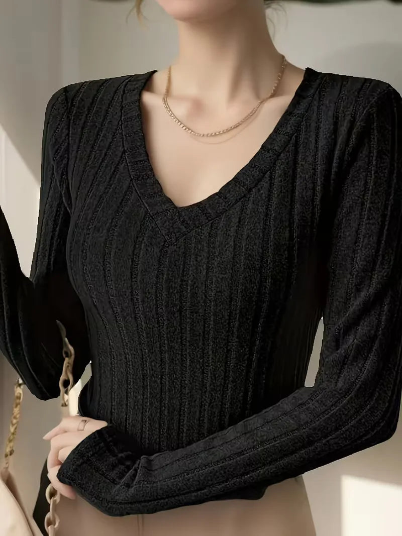 Comfortabele ribbel dames longsleeve met V-hals, verkrijgbaar in diverse kleuren.