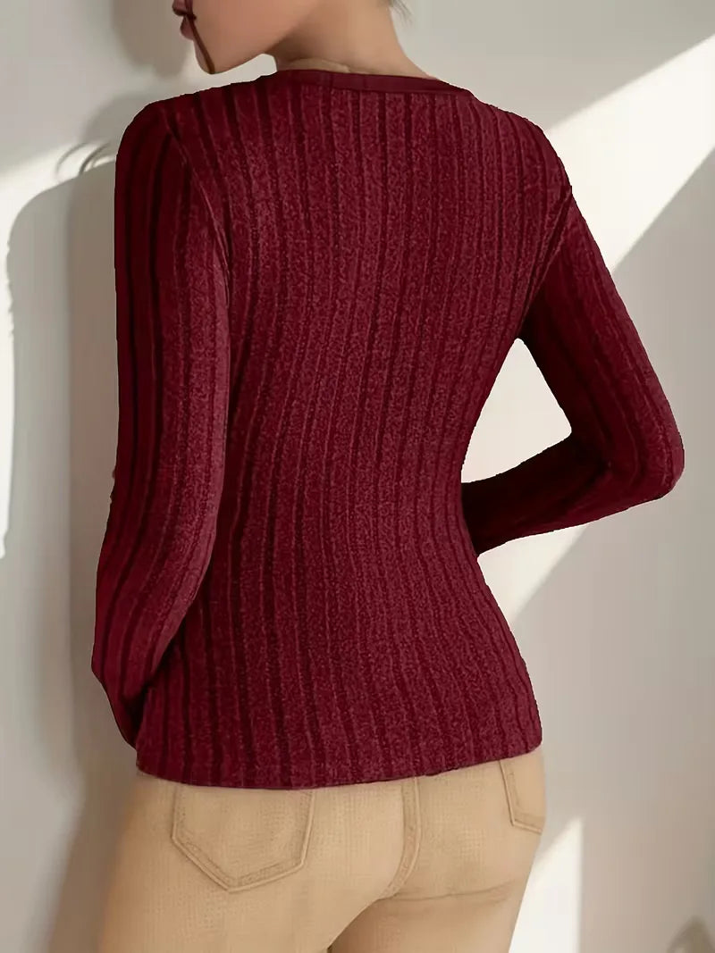 Comfortabele dames longsleeve met ribstructuur en stijlvolle V-hals.