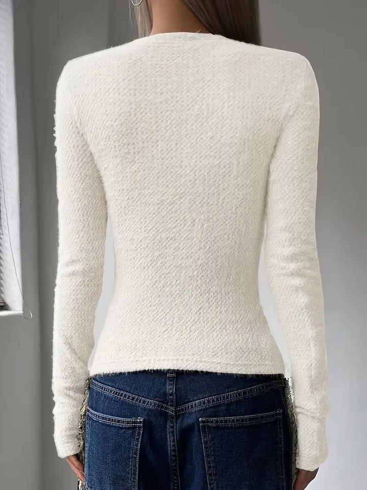 Stijlvolle dames longsleeve in een neutrale kleur, geschikt voor elke outfit.