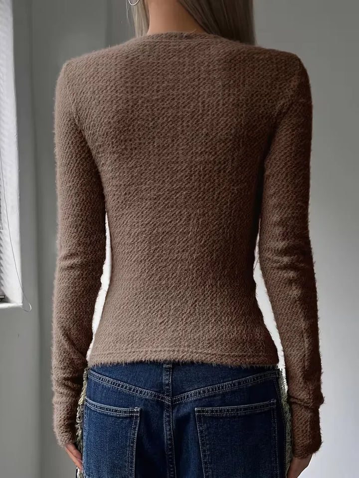 Modieuze dames longsleeve top, perfect te combineren met jeans.