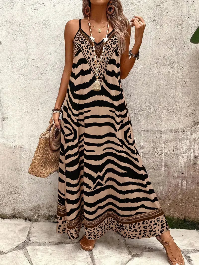 Casual maxi jurk met spaghettibandjes en trendy leopard design.