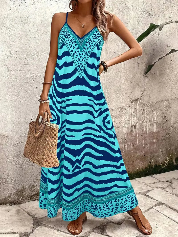 Luchtige maxi jurk met v-hals en levendige leopard print voor de zomer.