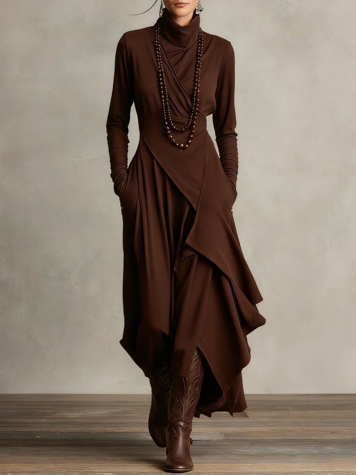 Unieke asymmetrische maxi jurk voor dames. Hoge col, lange mouwen. Moderne, elegante bohemian stijl. Perfecte damesjurk.