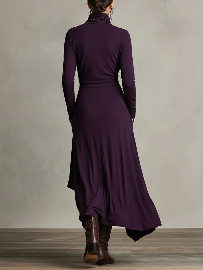 Elegante dames maxi jurk met hoge col en unieke asymmetrische rok. Comfortabele lange mouwen, ideaal voor elke gelegenheid.