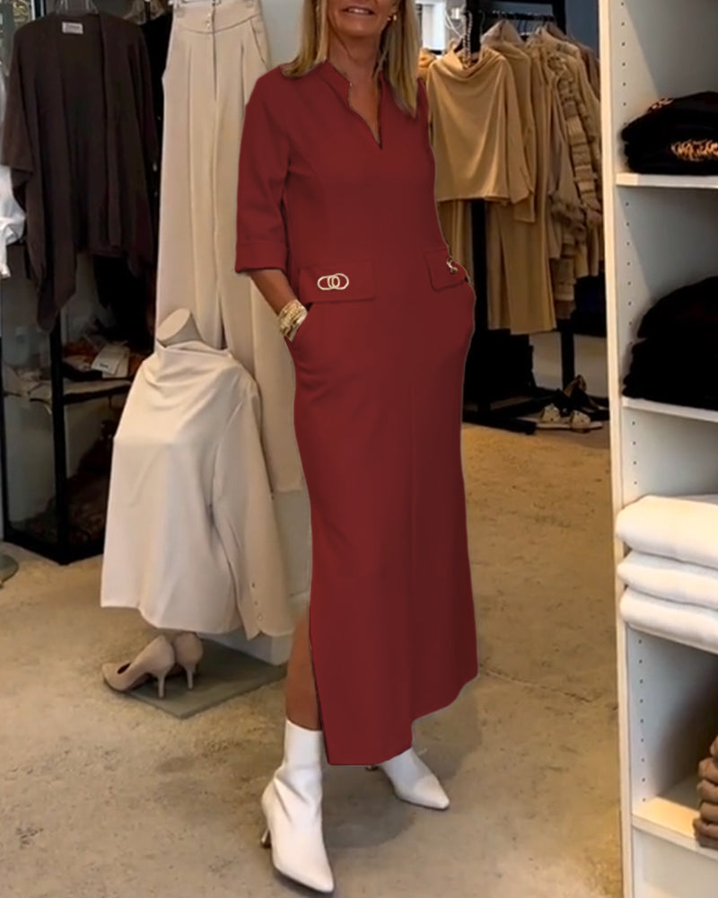 Lange comfortabele damesjurk met zakken, V-hals en 3/4 mouwen; ideale zomer- en lentekleding.