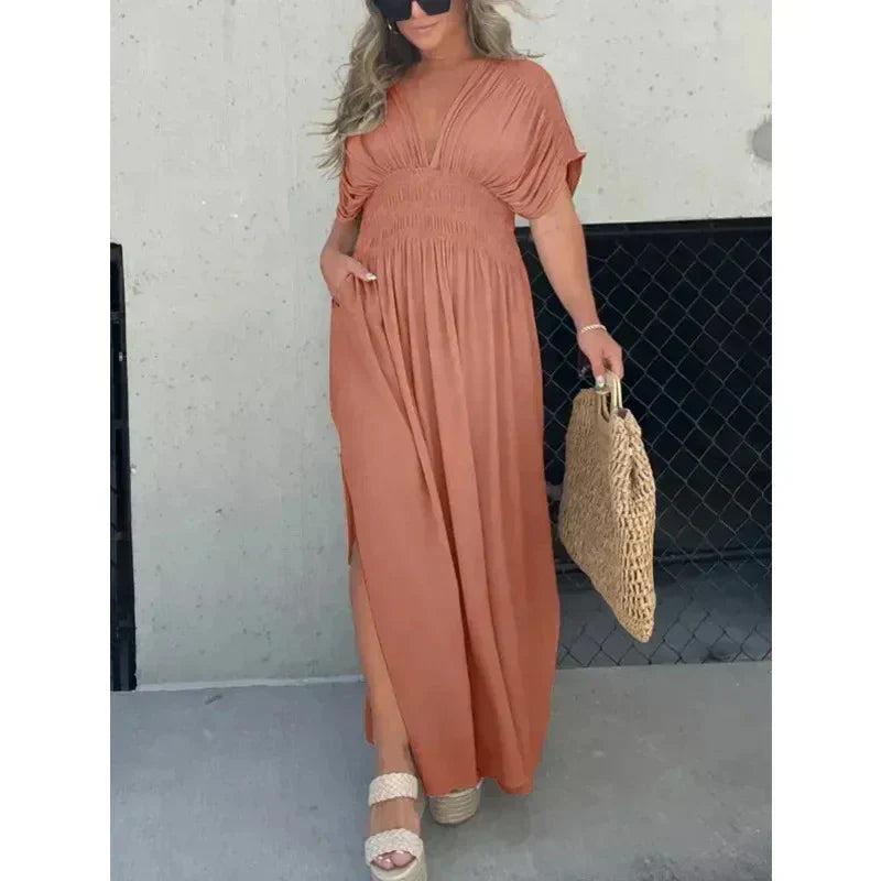 Trendy dames zomer maxi jurk met V-hals en split. Een must-have voor je zomergarderobe.