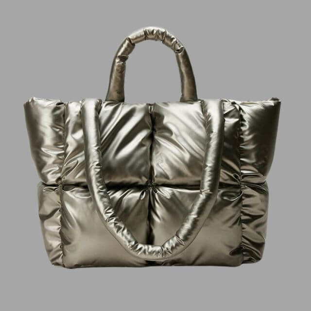 Stijlvolle metallic draagtas met puffer design, een veelzijdige dames tas.
