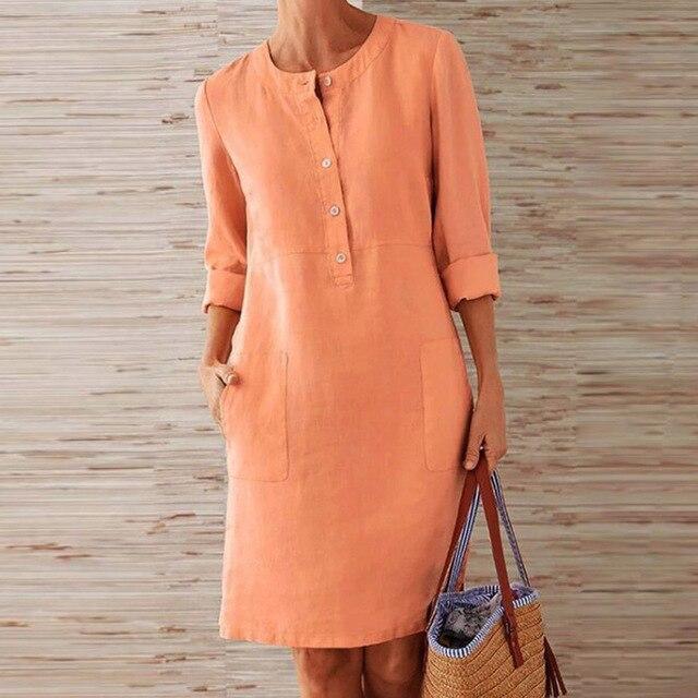Dames midi-jurk in helder oranje, perfect voor zomerse dagen. Luchtig, elegant en comfortabel.