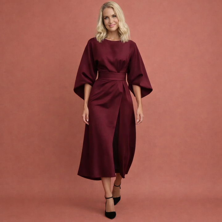 Modieuze herfst/winter midi-jurk met lantaarnmouwen; een stijlvolle keuze voor elke gelegenheid.