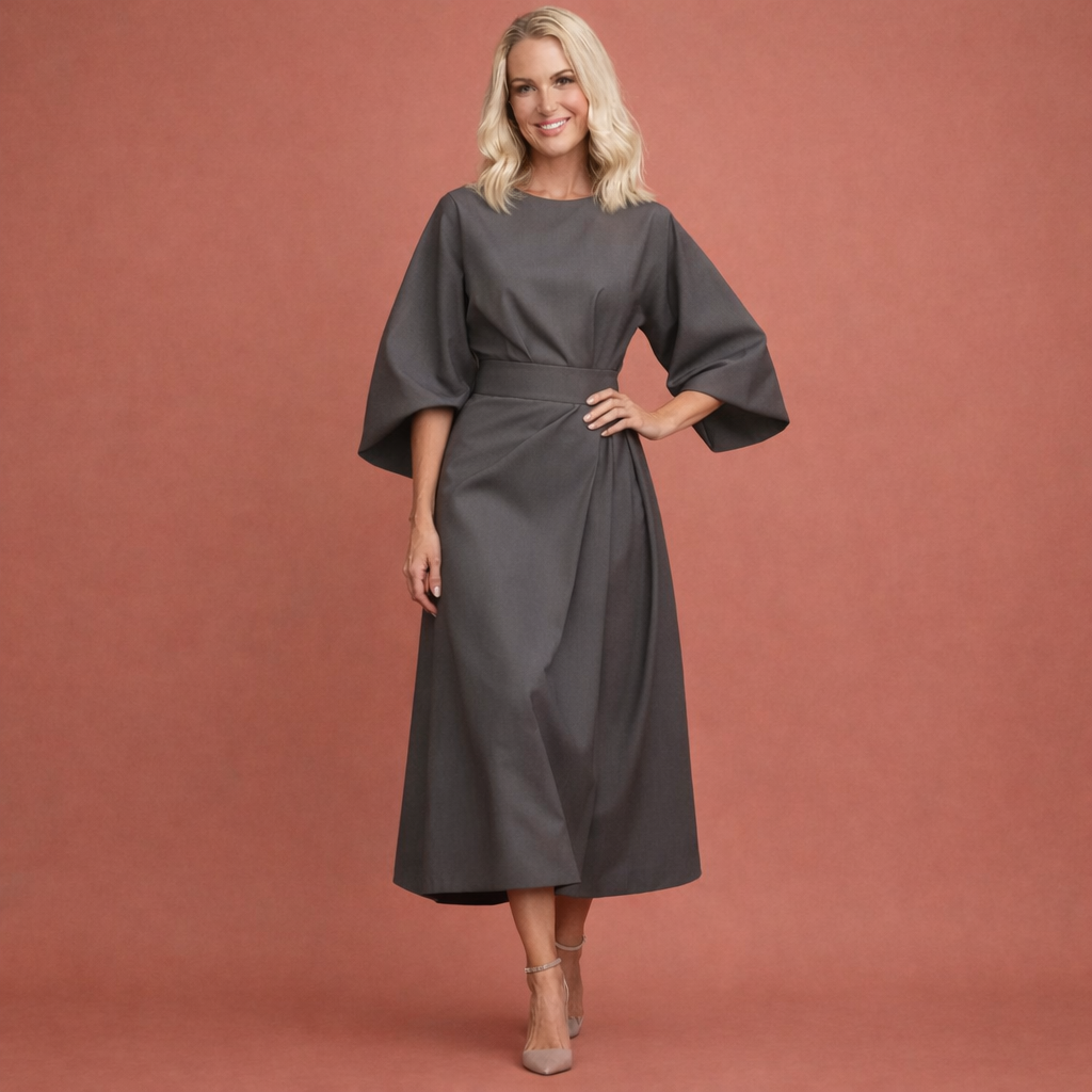 Flatterende dames midi-jurk met sierlijke lantaarnmouwen en accentuerende taille-ceintuur.