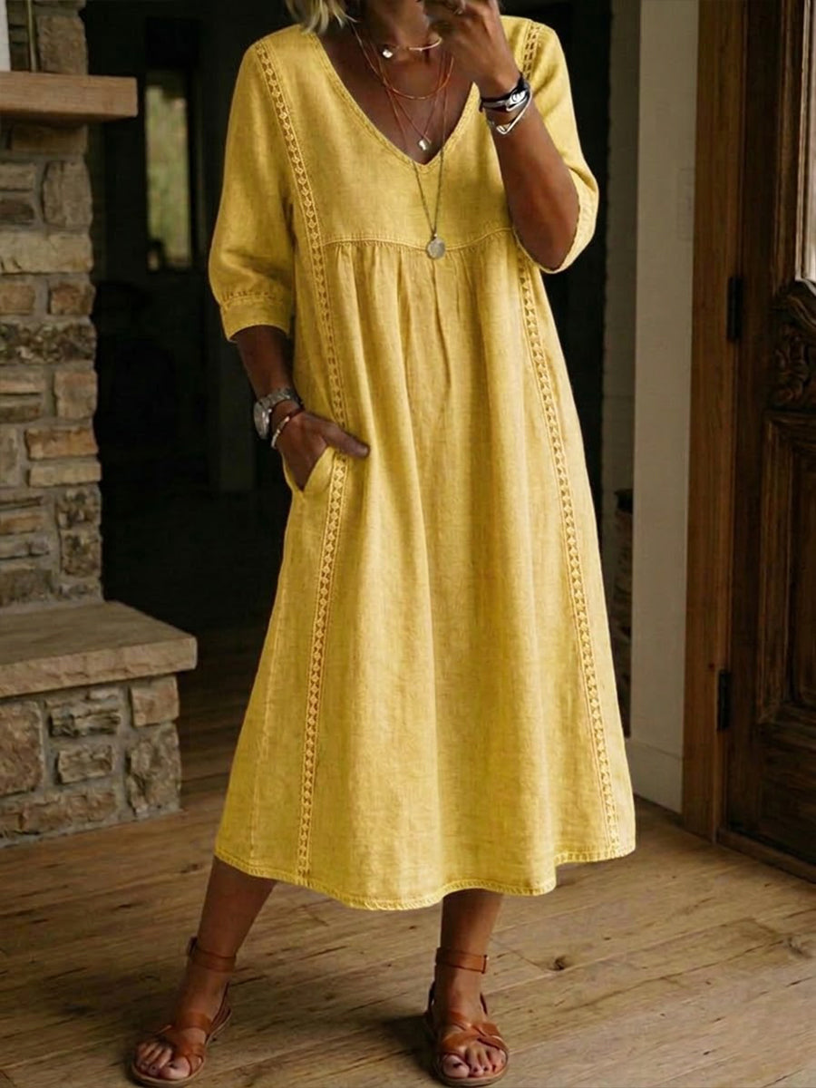Casual dames zomerjurk: midi lengte, V-hals, korte mouwen en vloeiende stof.