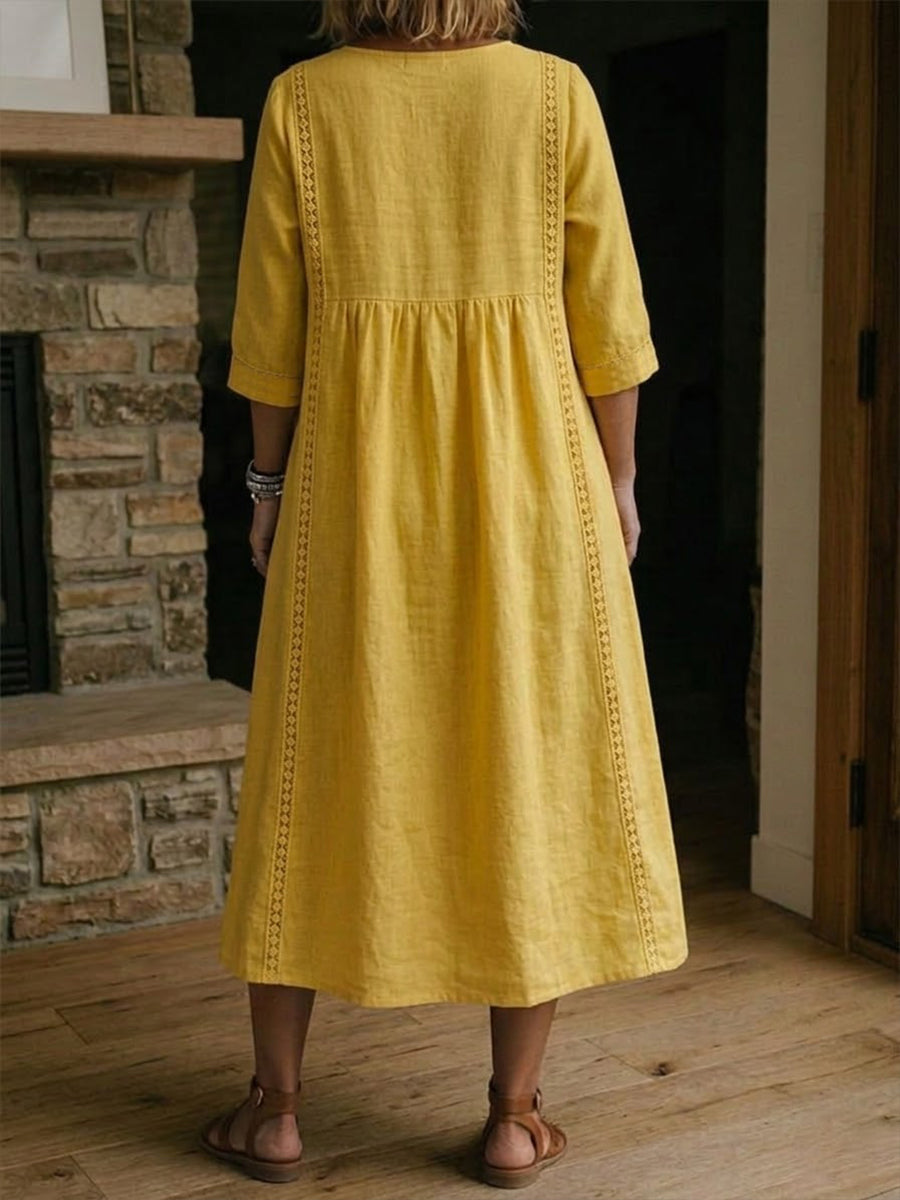 Comfortabele dames midi jurk met V-hals en korte mouwen, perfect voor een zomerse look.