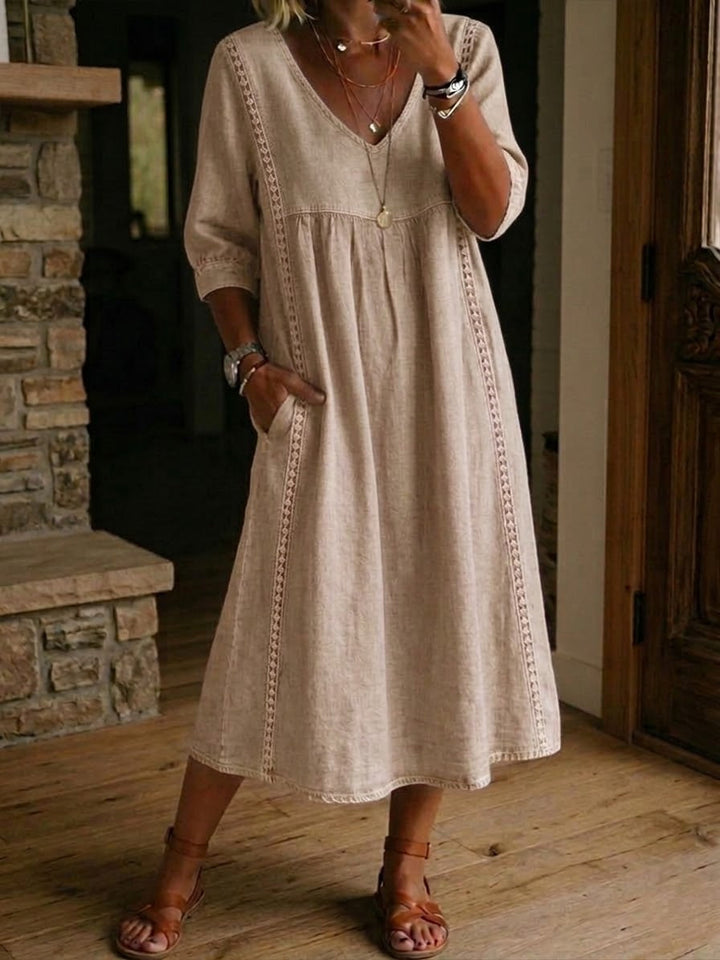 Modieuze dames zomerjurk: midi lengte, V-hals, korte mouwen en comfortabele, vloeiende pasvorm.