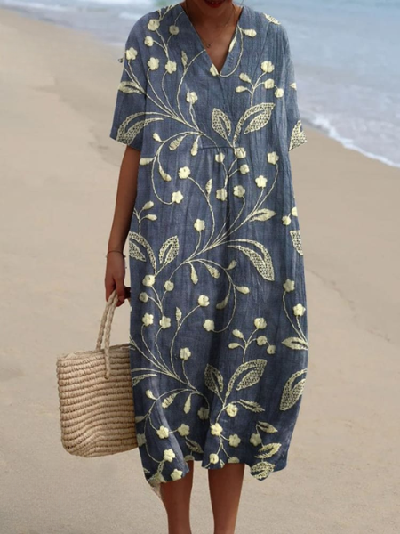 Dames midi jurk met vrolijke bloemenprint, V-hals en korte mouwen. Comfortabele casual jurk voor lente en zomer.