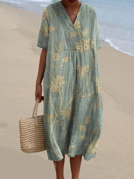 Veelzijdige dames midi jurk met bloemenprint, V-hals en korte mouwen. Perfect voor een comfortabele lente/zomer look.