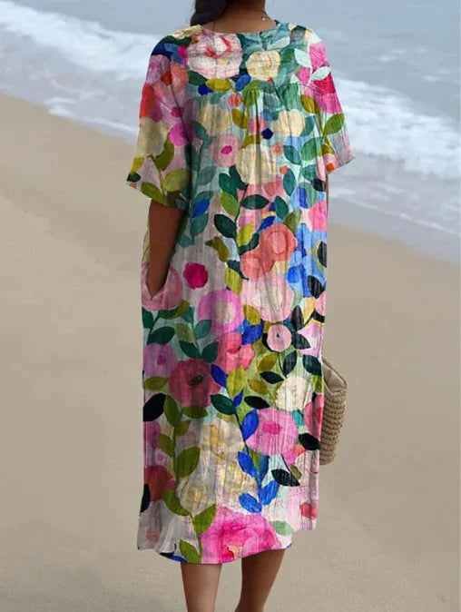 Stijlvolle dames midi jurk met V-hals, korte mouwen en bloemenprint. Comfortabele zomerjurk voor elke gelegenheid.