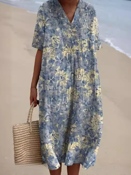 Casual dames midi jurk met bloemenprint, V-hals en korte mouwen. Ideaal voor een ontspannen lentedag.