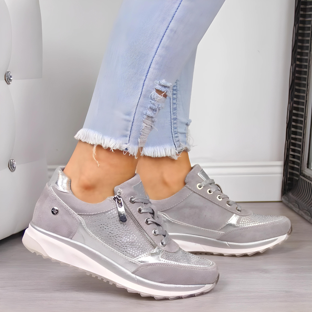 Zwarte orthopedische dames sneakers met ademend bovenwerk, geschikt voor casual en actieve dagen