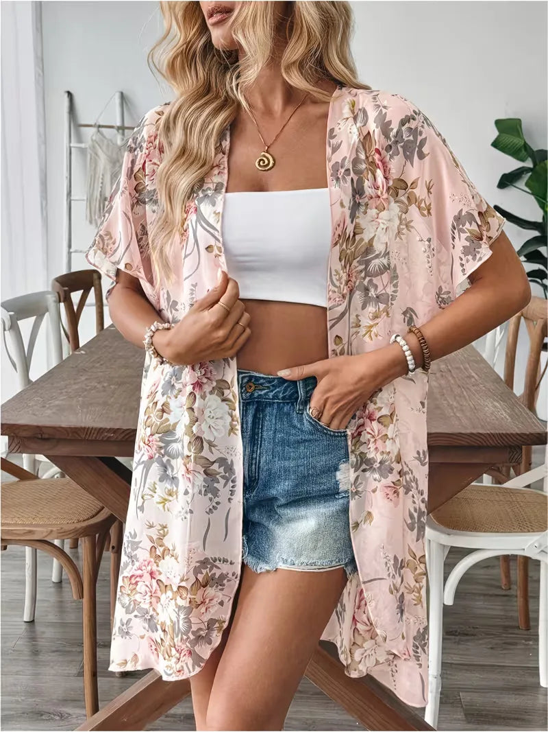 Trendy lange dames cardigan met bloemenprint, ideaal als open front zomerkleding of vakantie outfit.