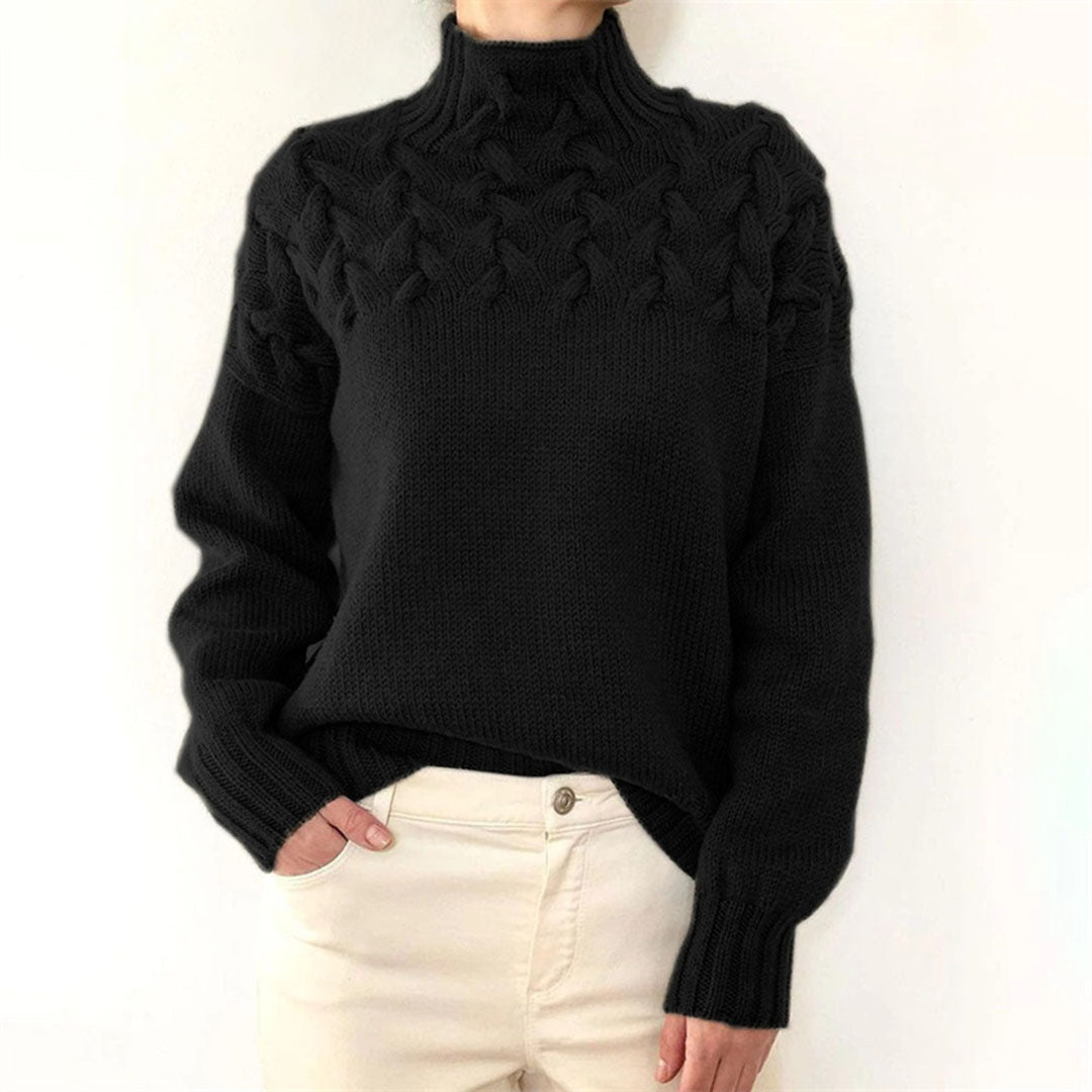 Close-up van de gebreide stof van een warme, stijlvolle oversized dames coltrui.