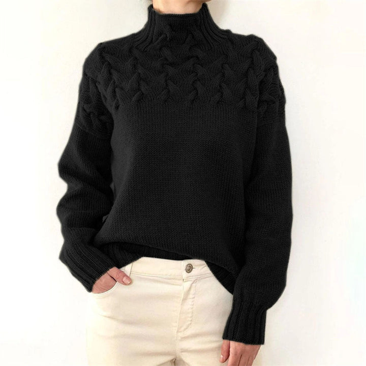 Close-up van de gebreide stof van een warme, stijlvolle oversized dames coltrui.